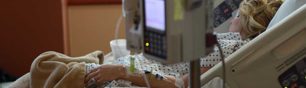 Woman in hospital bed